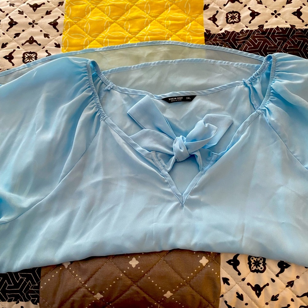 Light blue blouse, great for work or a night out in the town